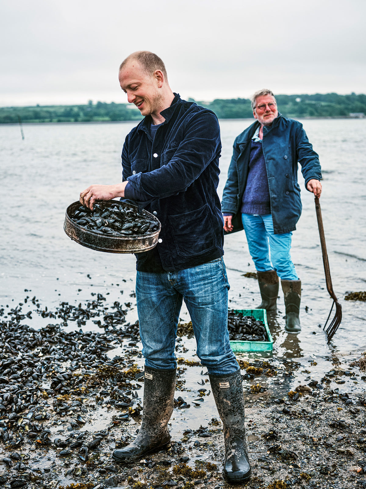 Two of the Lea-Wilson family collecting mussels on the Menai Strait