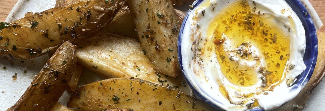 Spiced potato wedges with feta yogurt dip
